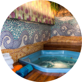 Hot tub with colorful wave mosaic.